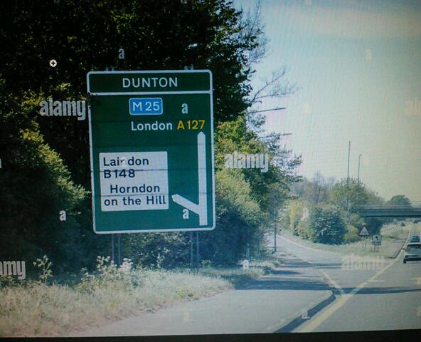 Printed road sign approaching Dunton
